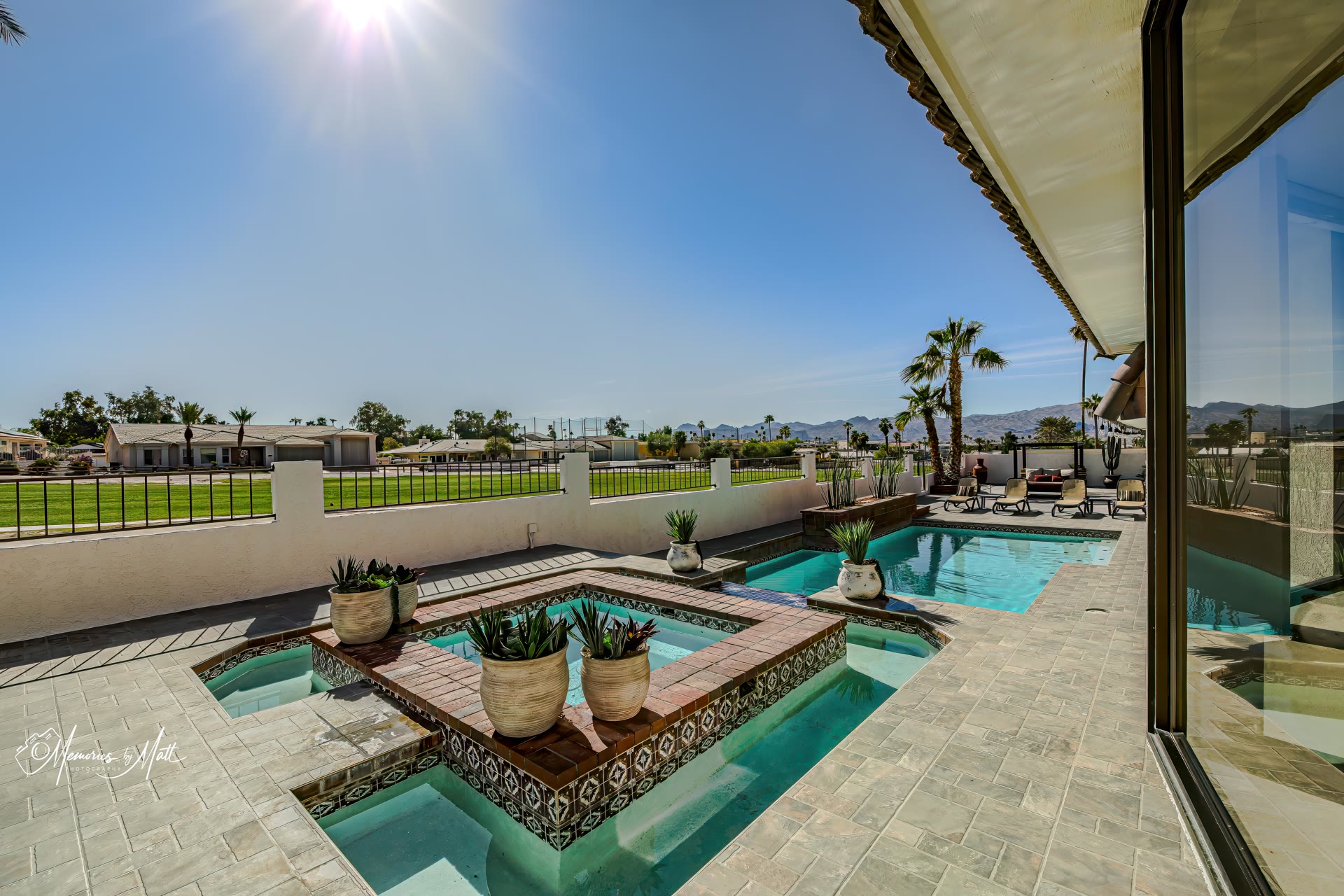 Daytime photo of a Lake Havasu City backyard pool and spa